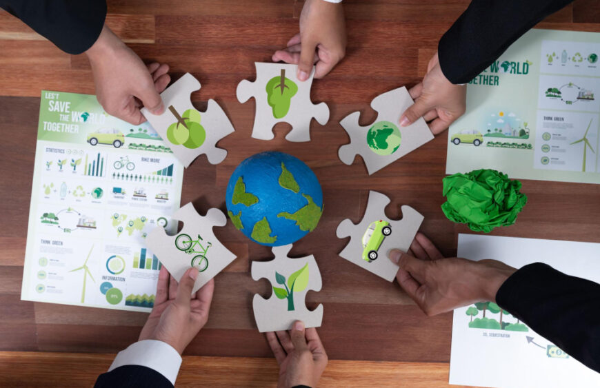 top-view-cohesive-group-business-people-holding-eco-icon-jigsaw-puzzle-pieces-around-globe-earth-as-eco-corporate-responsibility-community-sustainable-solution-greener-earth-quaint