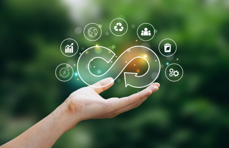 Hand of human holding economy circular icon.