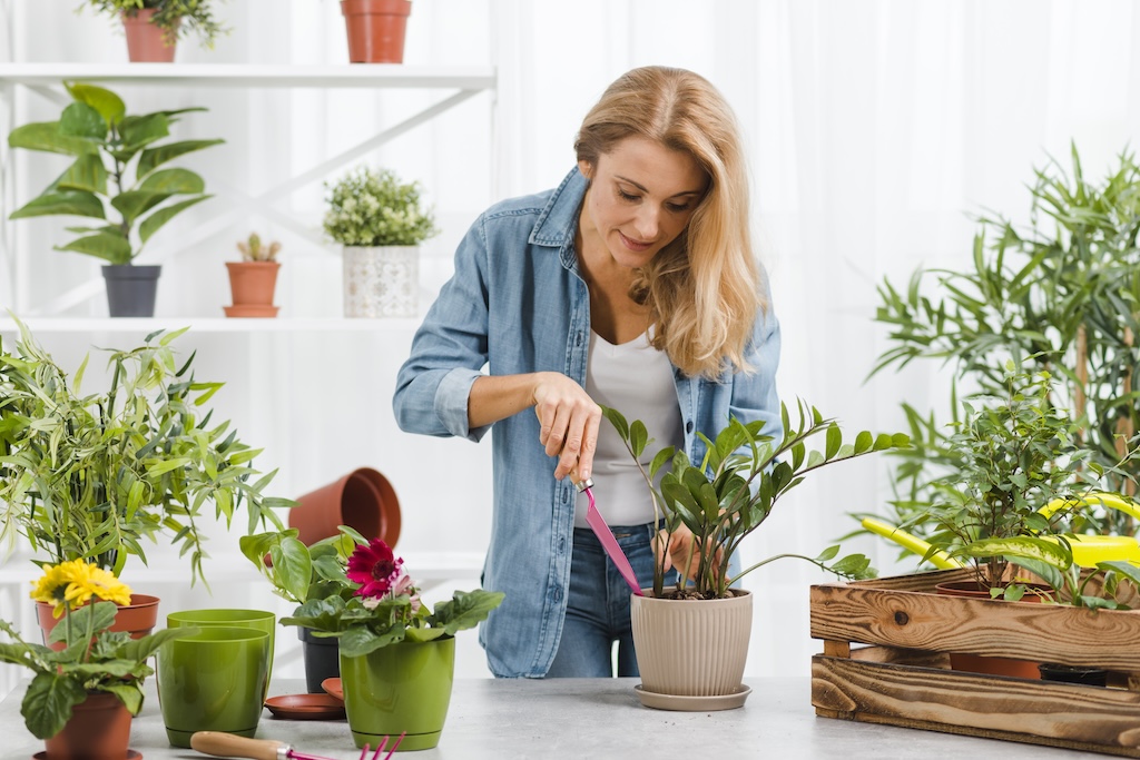 young-female-planting-flowers